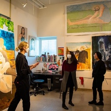 Anja Honisett welcomes visitors to her studio. Honisett's work focuses on the evolution of the depiction of the female form throughout art history, including the transition to the digitization of the image and its manipulation. 