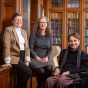 Jo L. Freudenheim, Victoria Wolcott and Michael Rembis sit together in a library. 