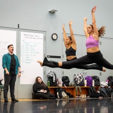 Dance students in Michael Deeb Weaver&rsquo;s class jump through the air. 