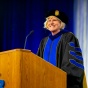 Dean Robin Schulze speaks at a College of Arts and Sciences commencement ceremony. 