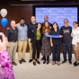 Members of the FOXG1 Research Center pose for a photo after a ribbon cutting. 