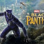 Black Panther crouches on a rocky overlook above a futuristic city as aircraft fly overhead, with the Marvel Studios &ldquo;Black Panther&rdquo; logo at right. 