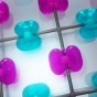 Purple and blue transparent shapes connected by a grid. 