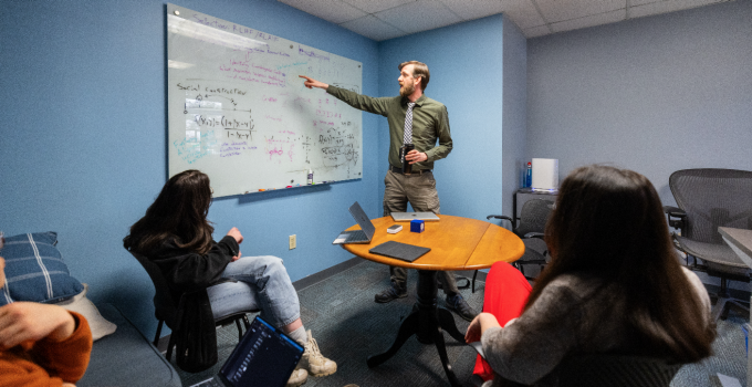 Students are meeting in a conference room.