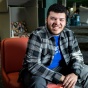 Travis White, AI+Responsible Communication major, pictured in Lockwood Library. 