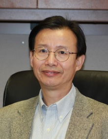 Headshot of Xuedong Hu. 
