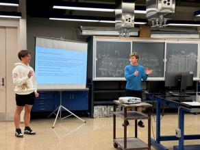Zoom image: High School students giving presentation on the Summer Science project. 