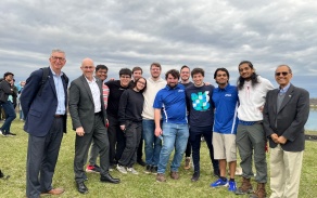 Zoom image: Left to right: Provost Weber, SEAS Dean Kemper Lewis, Parth Agrawal, Ruben Jovel, Brian Syzbist, Jaynie Tercovich, Kyle Palmatier, Nick McNally, Ryan Tyznar, Dario Tringali,* Krish Patel,* Arnav Mohapatra, and President Tripathi at the balloon launch on April 8. *Indicates physics majors. Photo by Grace Testa. 