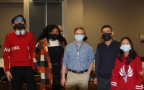 Zoom image: Undergraduate students and Prof. Zeng with his daughter at the holiday party. 
