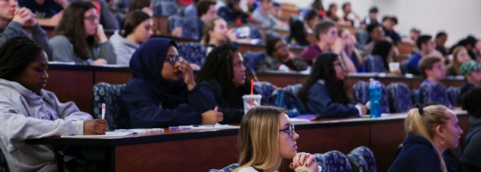 Students gathered in a lecture hall. 