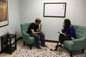 A patient with a practitioner.