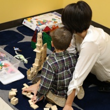 Therapist and child in the PCIT therapy room. 