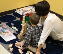 Therapist and child in the PCIT therapy room.