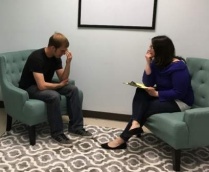 A clinician with a client. 