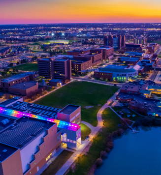 Aerial images taken at sunset of the Center for the Arts with rainbow lighting in the atrium glass. 