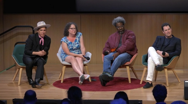 Shira Gabriel sitting on stage with three other podcast guests. 