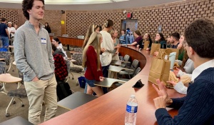 UB students speaking with AP psychology high school students. 