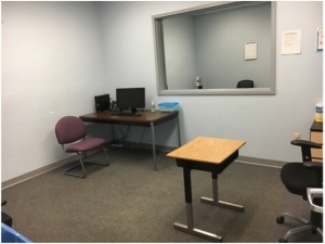 Zoom image: Desk in center of room.