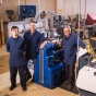 Thomas, Kevin and Gary in the machine shop. 