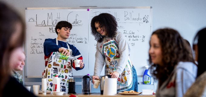 Students in Mariann Caprino&rsquo;s Italian 111 class host a caf&eacute; activity in Clemens Hall in February 2026. The students played a game at the tables, while other brought coffees and snacks from the caf&eacute; table. 