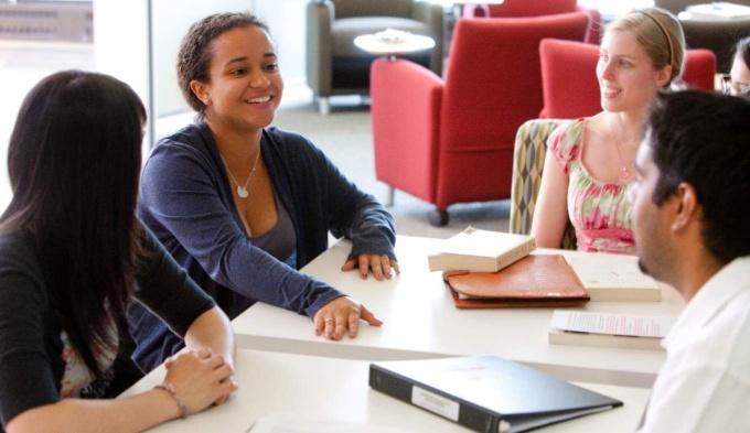 Students sitting around a table.