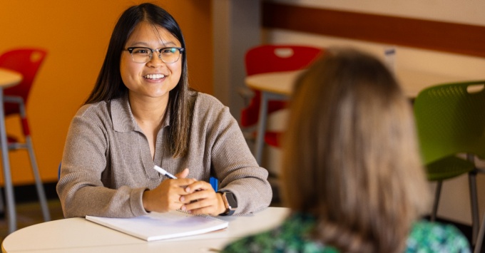 Student getting hands-on experience in an office. 