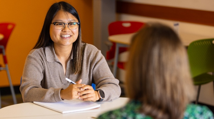 Student getting hands-on experience in an office. 