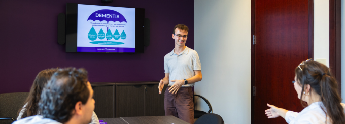 Claire Corwin, with Health and Human Services, works with MSW student Brendan Quigley at the Alzheimer's Association WNY location in Amherst, NY.