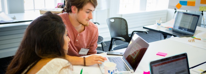 Two students working together on a project. 