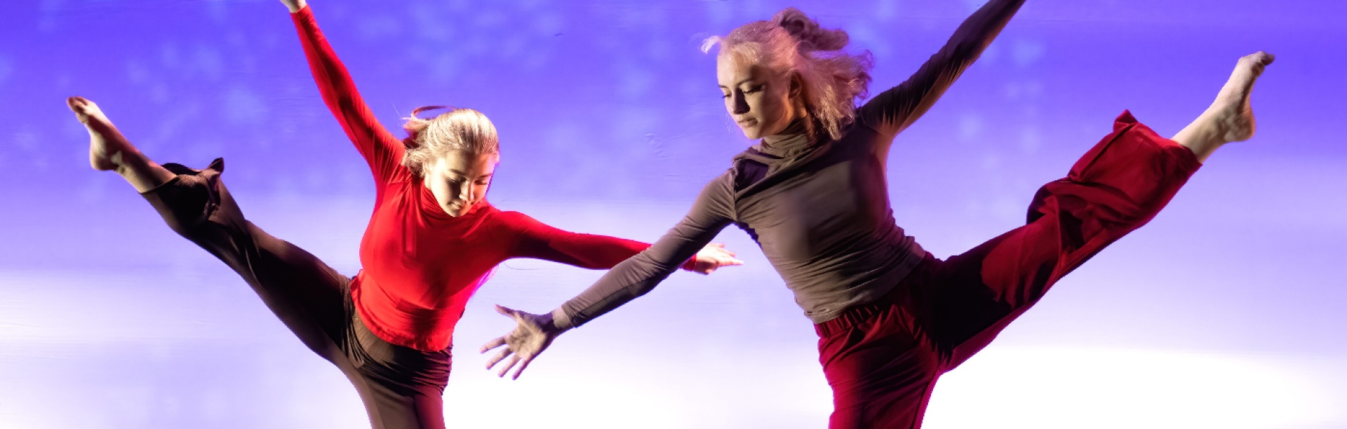 Group of female dancers displaying "jazz hands". 