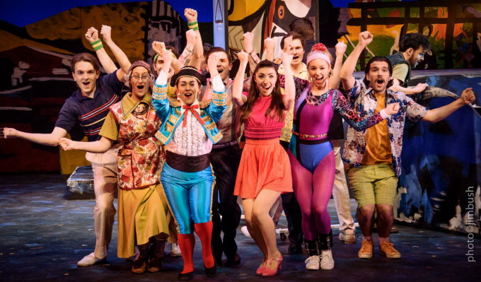 Students in costume cheering to the camera.