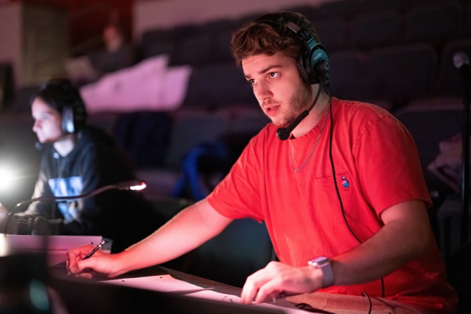 Student at lighting console. 
