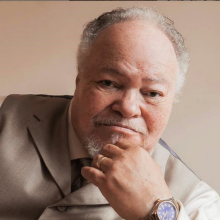 Headshot of Steven Henderson, an older black male. 
