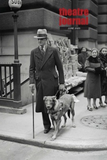 Photo of a blind man walking a dog. 