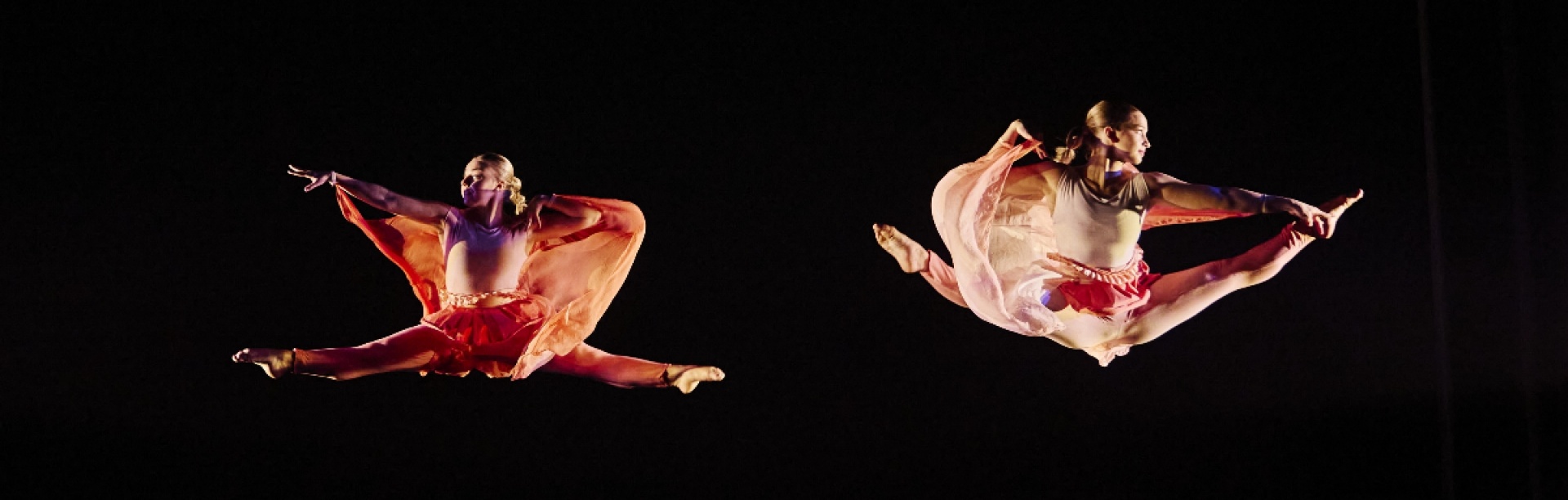 two dancers in air.