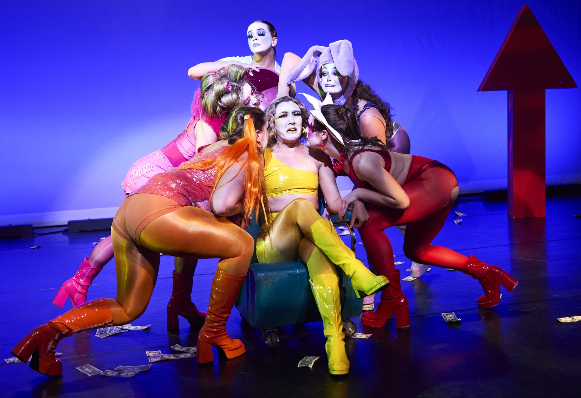 colorfully costumed dancers on stage. 