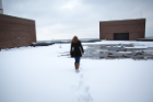 UB Master’s student Meg Corcoran collect snow from the roof of Cooke Hall. Meg measured the stable water isotopes in precipitation to study the water cycle, including lake effect precipitation. Photographer: Meredith Forrest Kulwicki