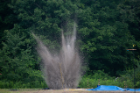 Debris flies during one of the workshop's four explosive tests. The blasts were generated by sticks of a high explosive called PETN. Photo: Meredith Forrest Kulwicki