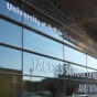 Glass exterior of Jacobs School of Medicine and Biomedical Sciences. 